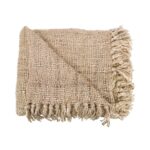 Plaid Le s'il vous Beige en coton tissé main avec franges posé sur canapé