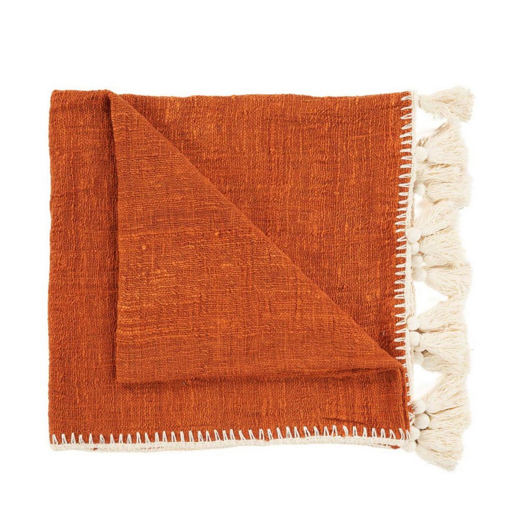 Jeté Stitch en coton terre cuite, jeté de lit décoratif au style naturel et chaleureux, idéal pour chambre ou salon.