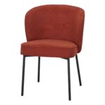Chaise rembourrée terracotta Fantine en tissu avec pieds noirs pour salle à manger.