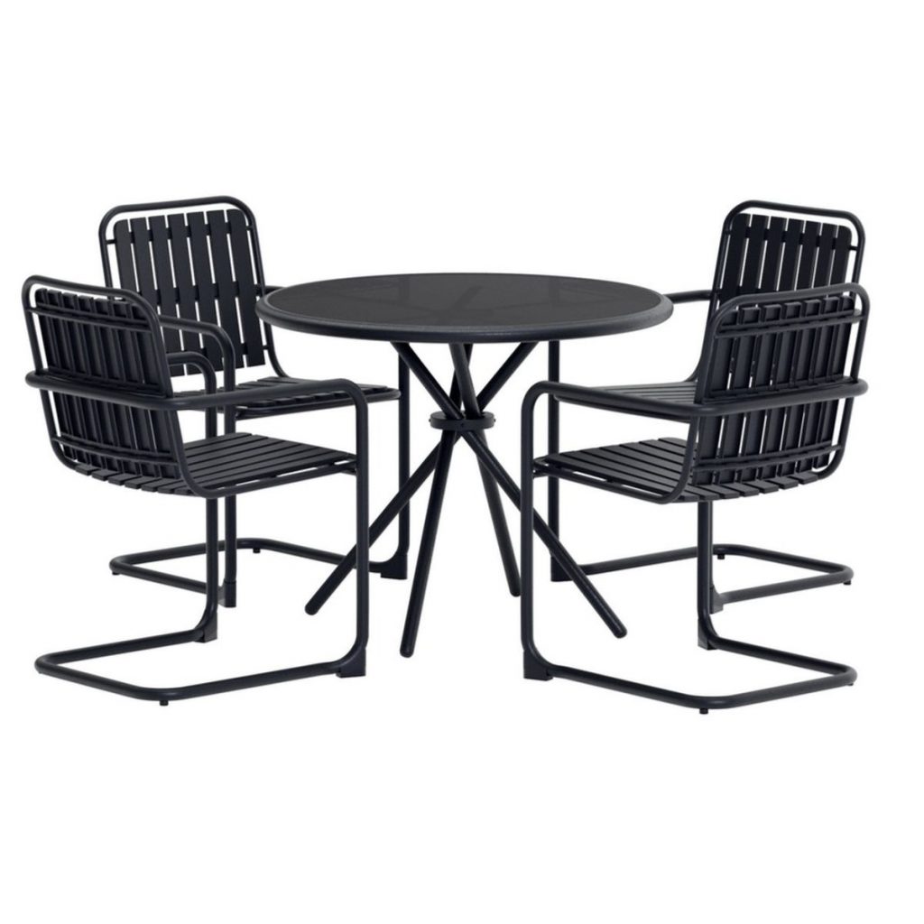 Ensemble repas Chelsy avec table ronde et quatre chaises en métal.