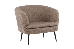 Fauteuil de salon Noth en tissu bouclé beige avec pieds acier noir dans un intérieur contemporain