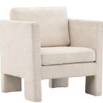 Fauteuil de salon blanc Raids en tissu bouclé avec accoudoirs hauts et coussins amovibles dans un intérieur contemporain