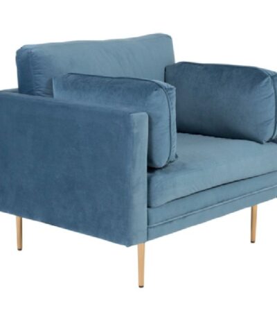 Fauteuil de salon bleu Bosco en velours avec assise profonde et coussins dans un intérieur contemporain