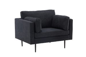 Fauteuil de salon noir Bosco en tissu avec coussins généreux et pieds fins en acier dans un intérieur contemporain
