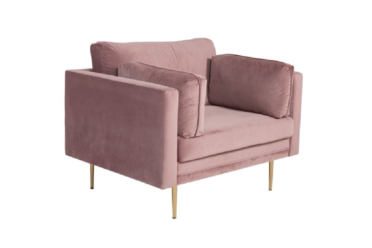Fauteuil de salon rose Bosco en velours avec assise profonde et coussins dans un intérieur contemporain