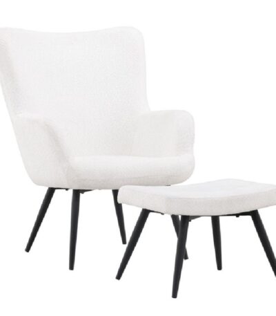 Fauteuil relax blanc Komodor avec repose-pieds en tissu bouclé et piètement noir dans un salon contemporain