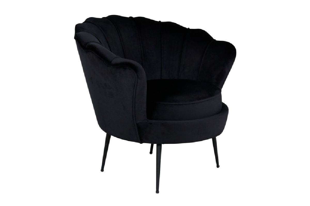 Fauteuil en velours noir Cappel avec dossier coquille et pieds acier noir dans un intérieur contemporain